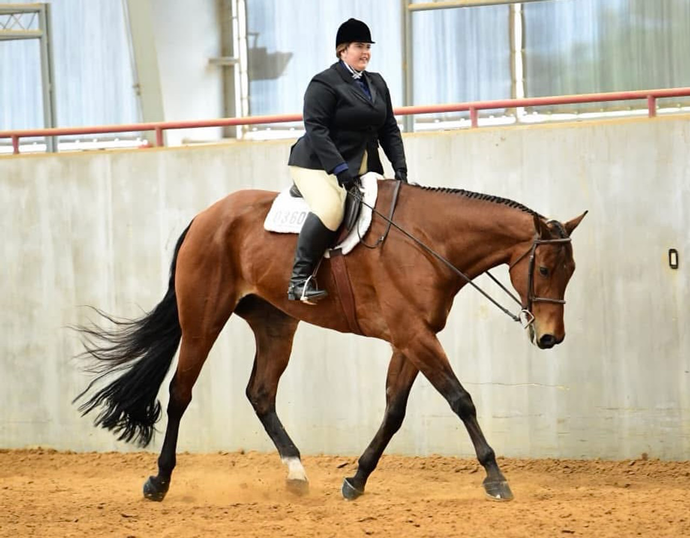 Dr. Chloe Benning on a horse.