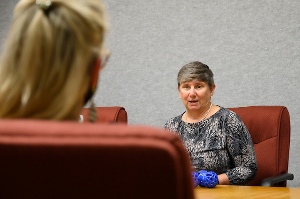 Dr. Pauline Prince at a conference table.