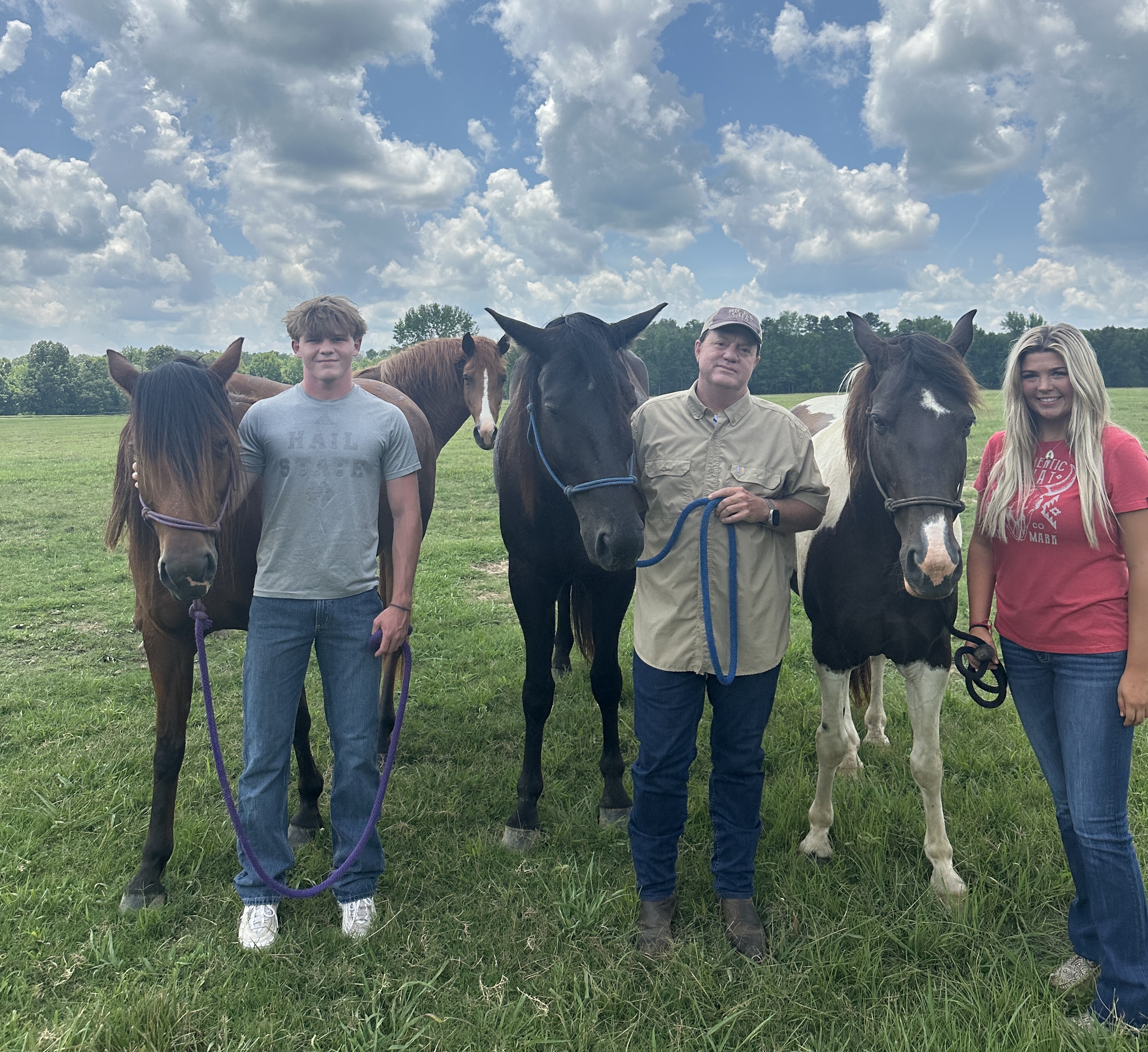Three people and three horses