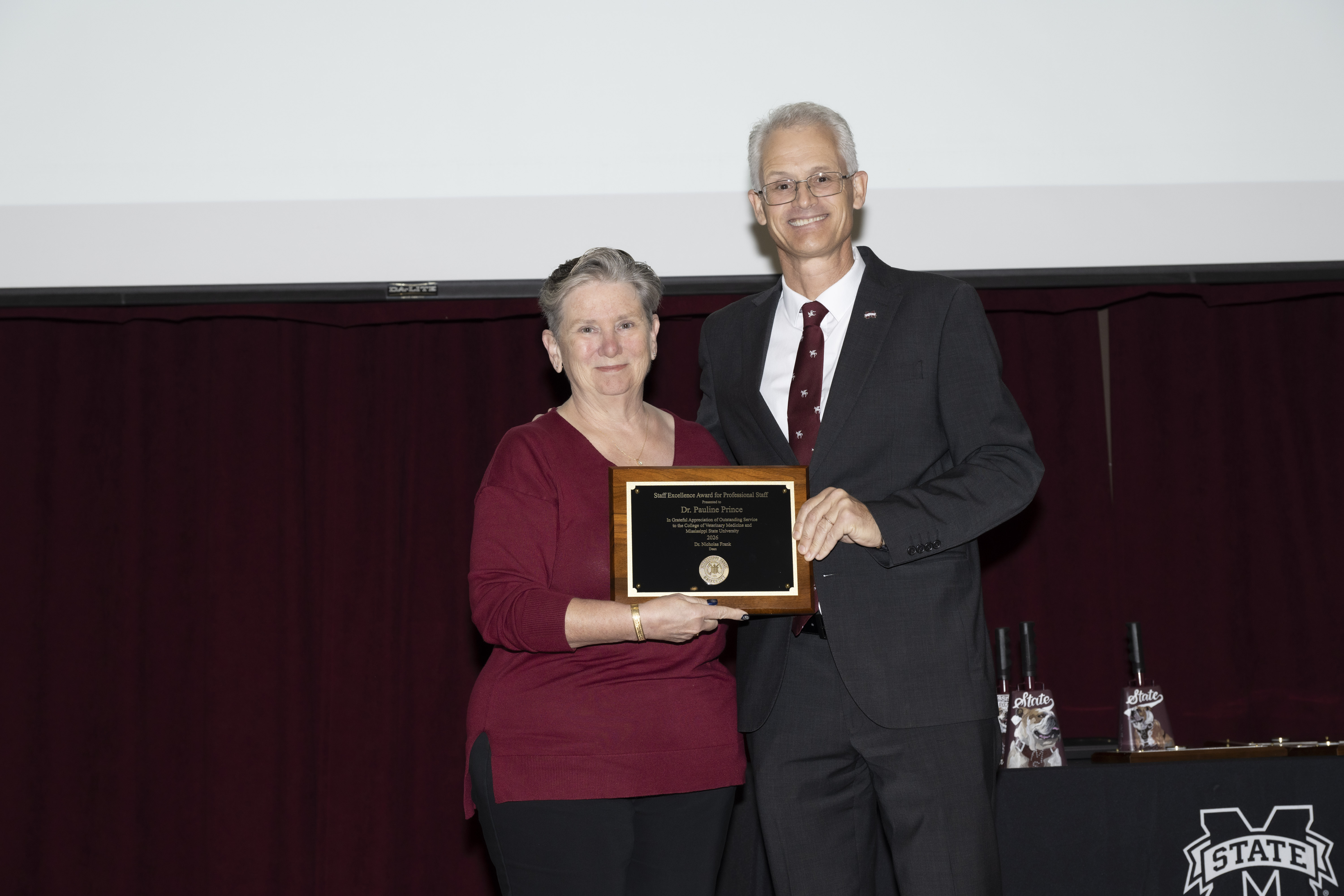 Dr. Pauline Prince receives the Staff Excellence Award for Professional Staff from Dean Nicholas Frank.