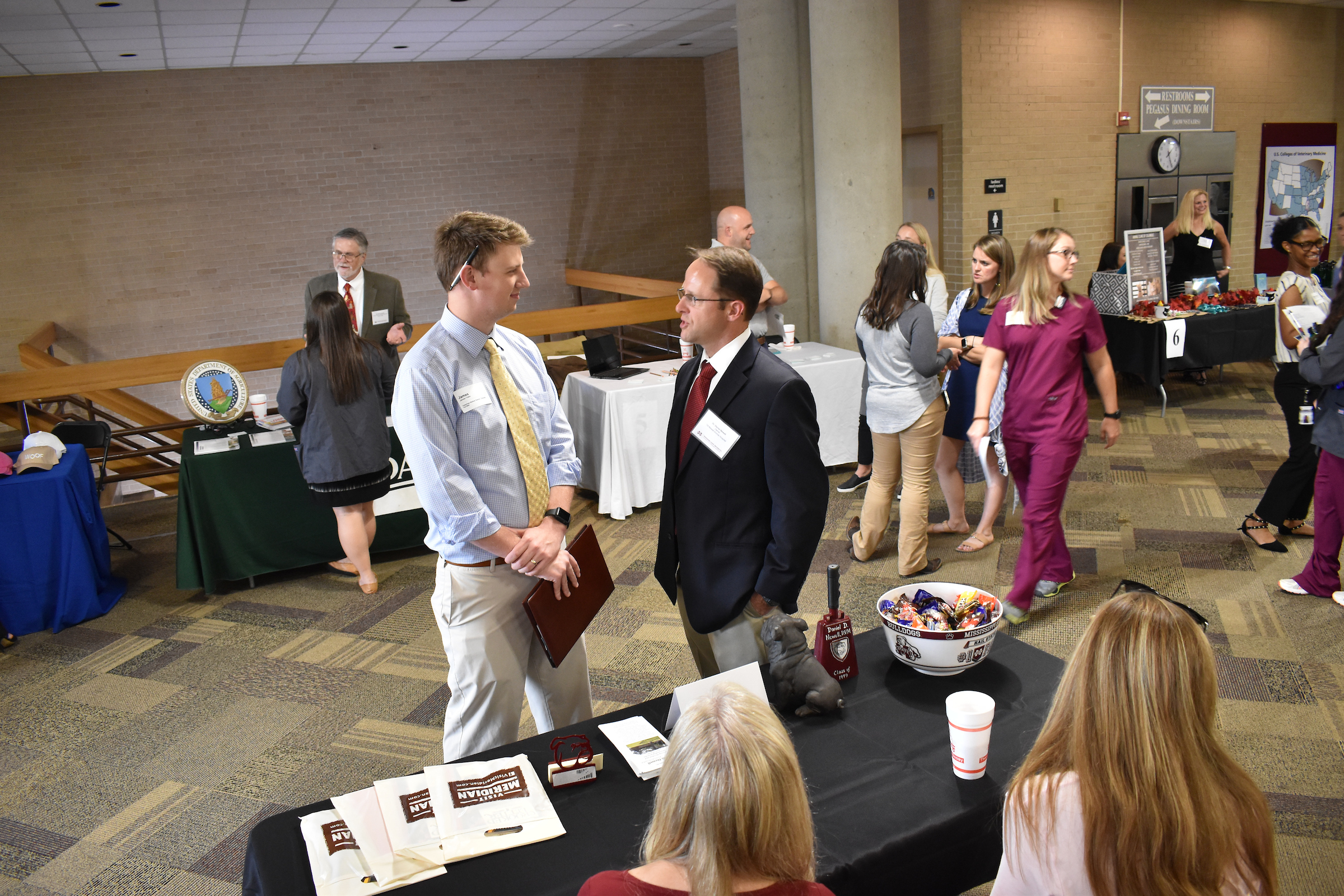 A student engages with a job recruiter