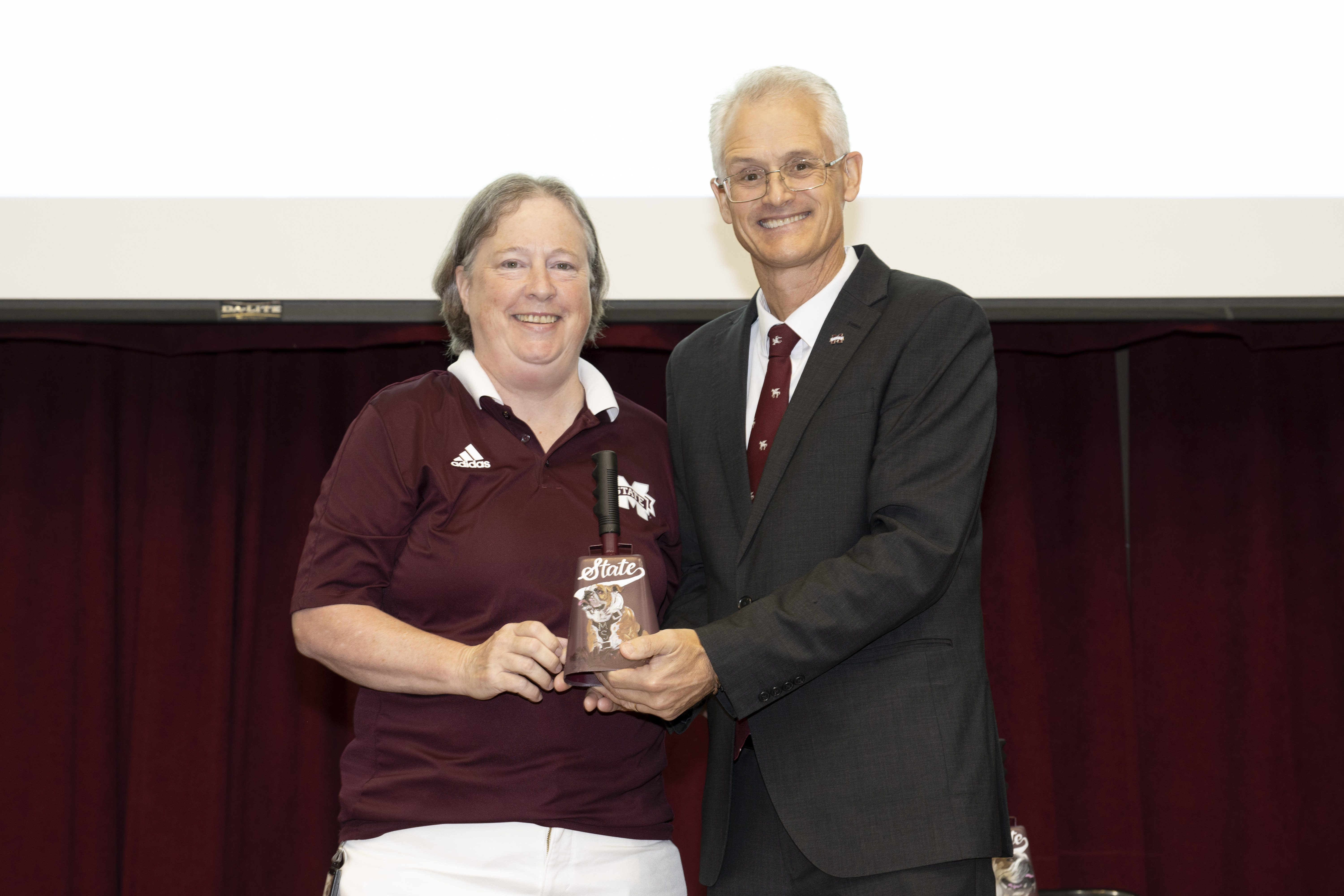 Terri Snead, CVT, receives the 2026 E. Wynn Jones Award from Dean Nicholas Frank.