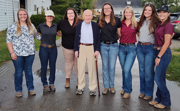 Seven vet students and a professor.