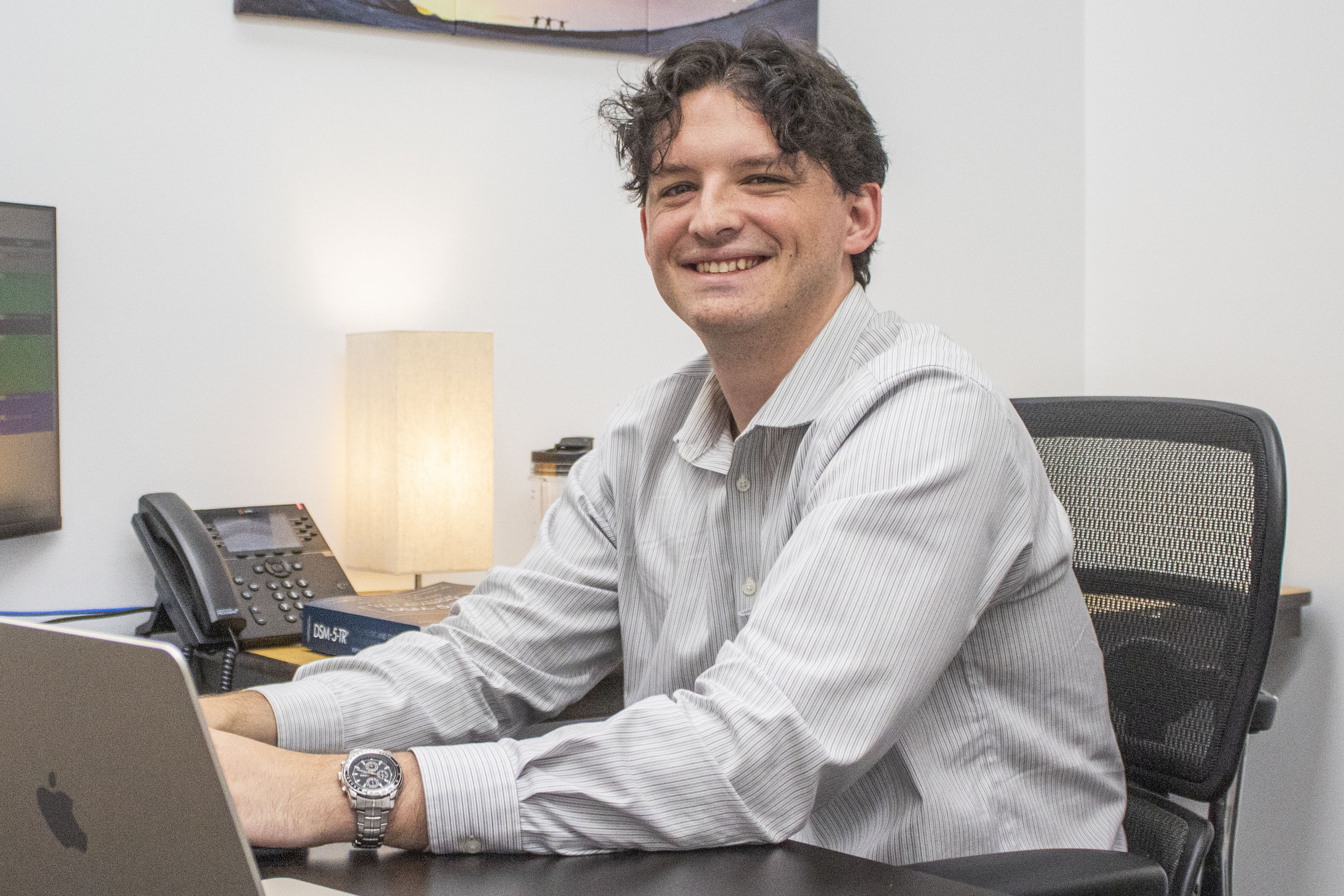 Maggie Freeman-Bishop Graduate Assistant Brett Bain sits at his desk in his office at the Mississippi State University College of Veterinary Medicine Wise Center.