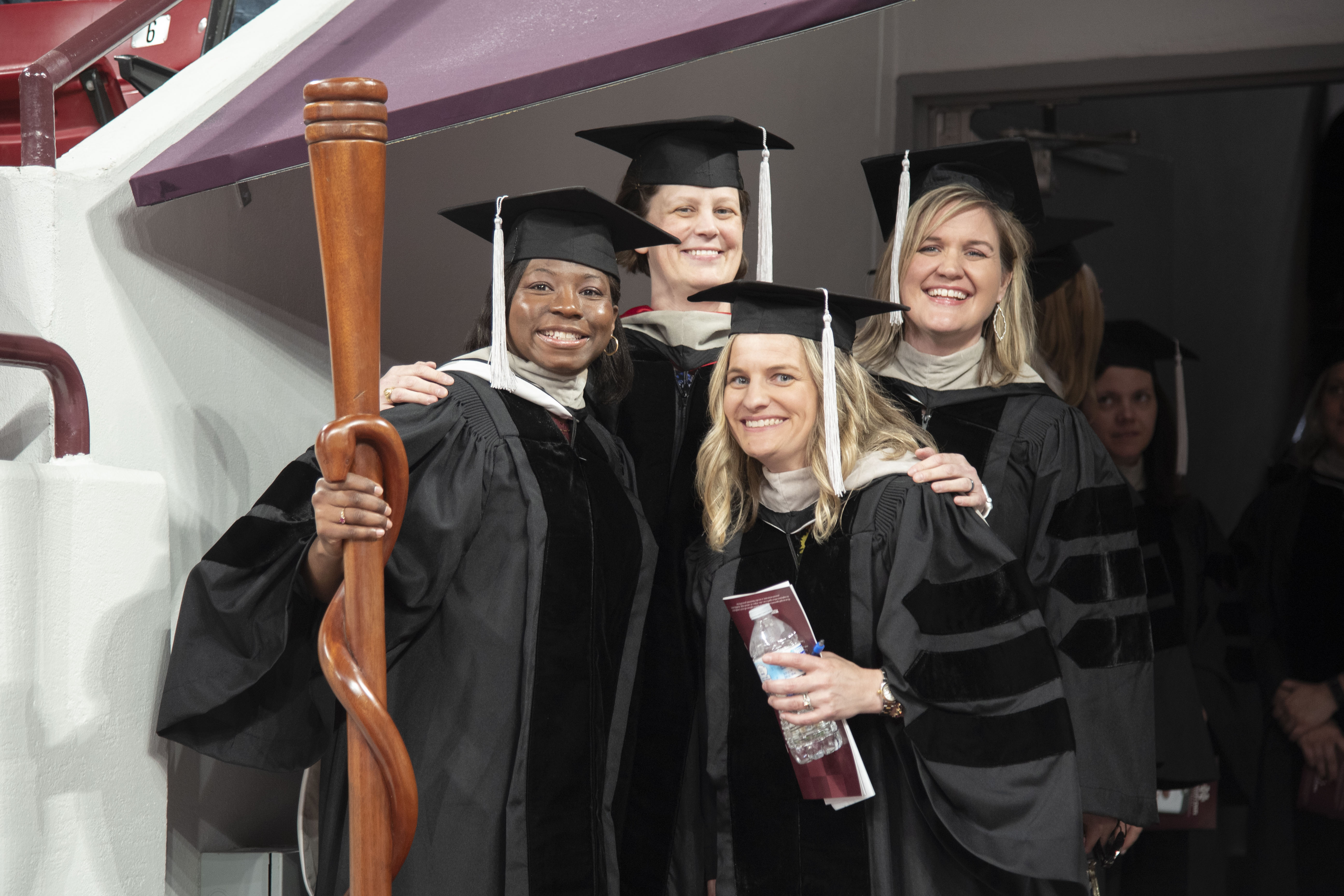 Doctors pose at graduation