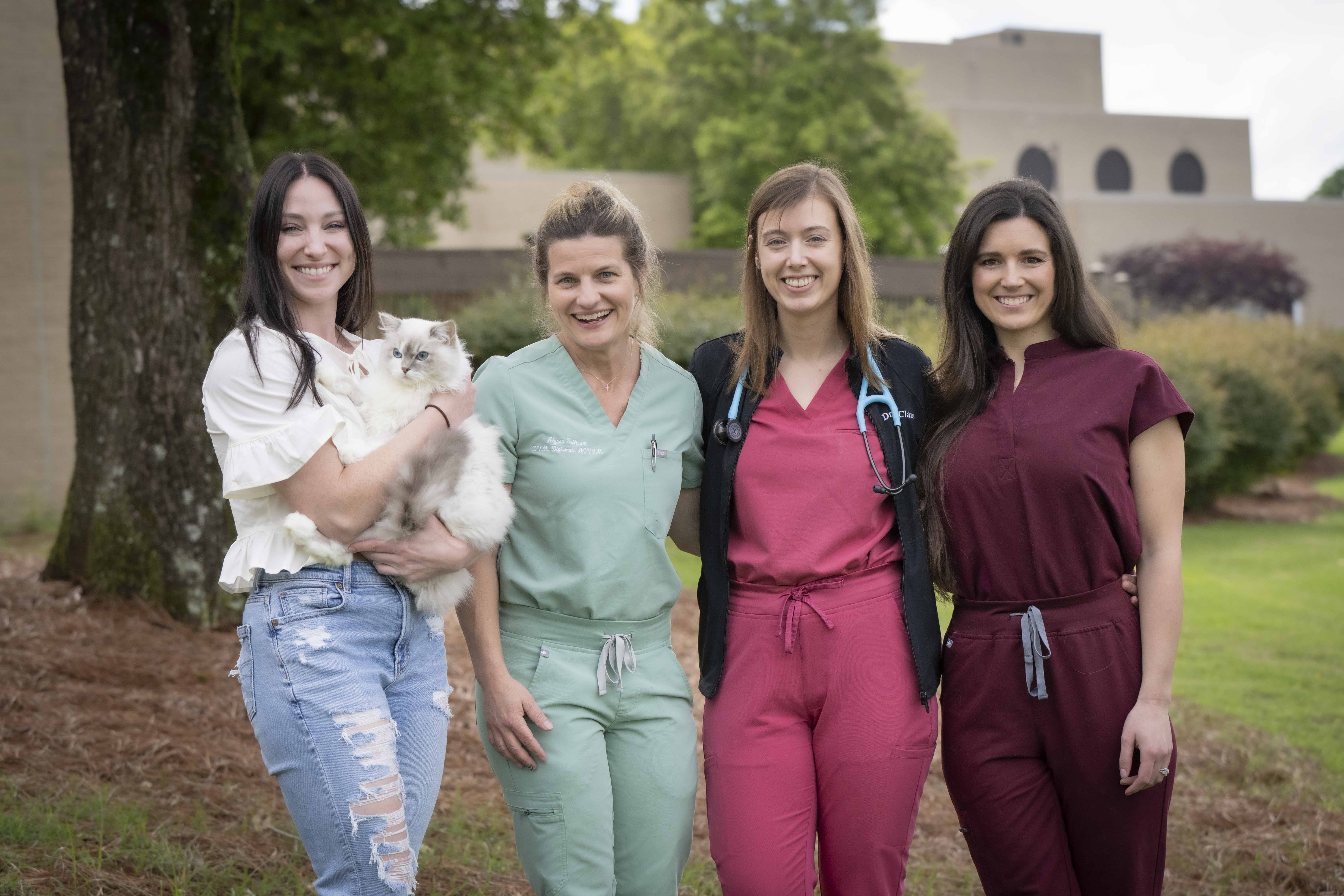 Four ladies and a cat.
